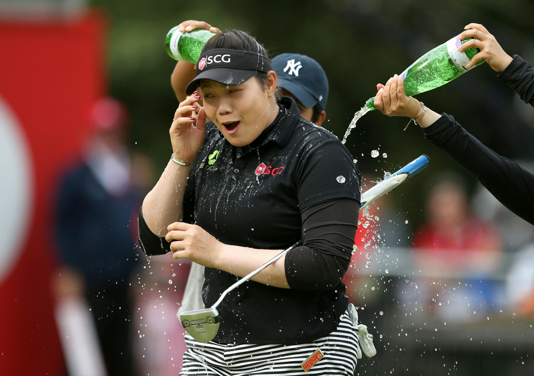 Thailand's Ariya Jutanugarn celebrates after sinking her putt to win the Women's British Open during day four of the Women's British Open at Woburn Golf Club, Woburn, England, Sunday July 31, 2016. Jutanugarn took the Women's British Open title at the tree-lined Woburn course. (Steve Paston / PA via AP)