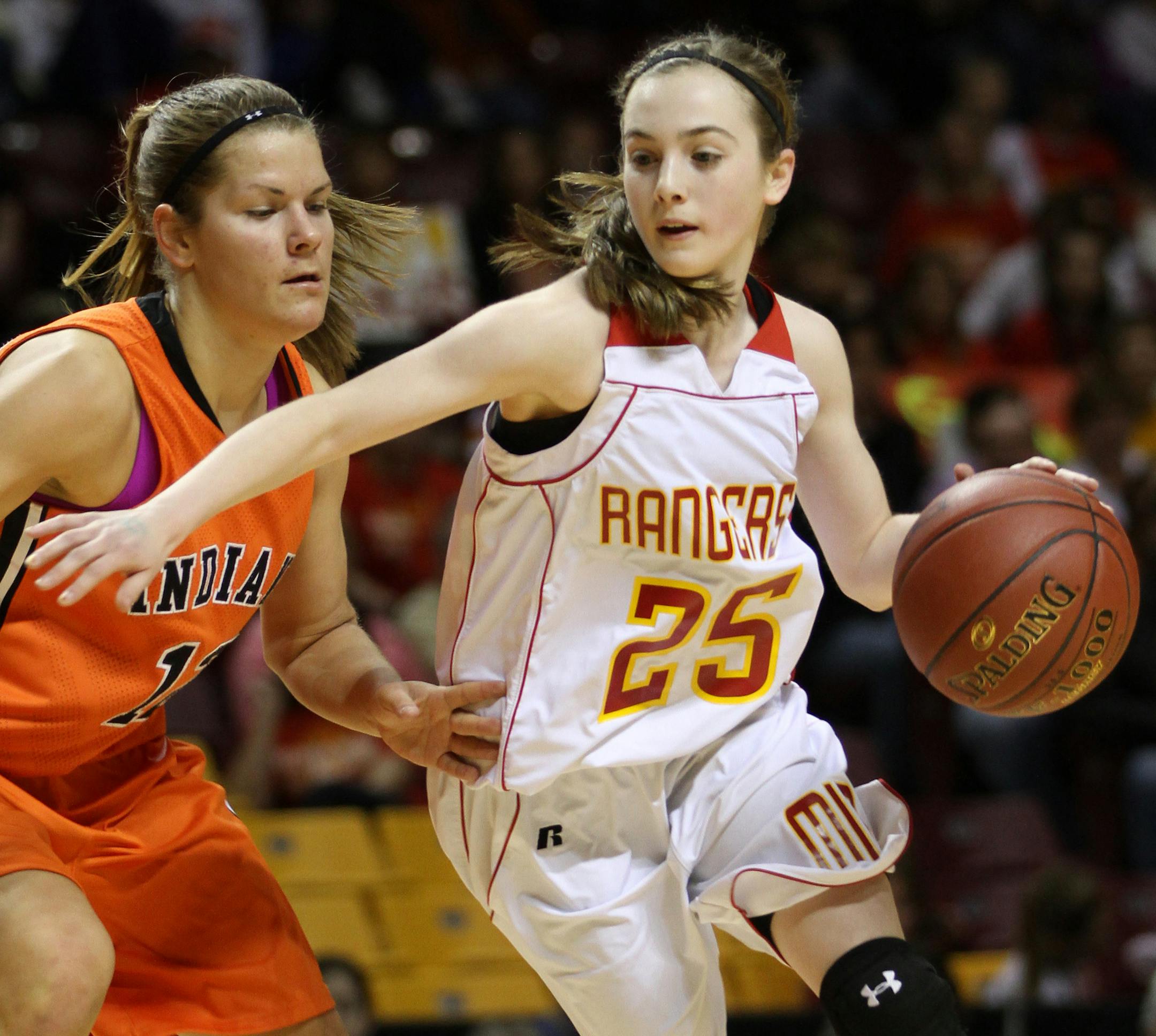 Girls State Basketball Tournament, Class 1A quarterfinals, Williams Arena, Mountain Iron-Bhul vs. Sleepy Eye, 3/15/12. (left to right) Sleepy Eye's Sydney Remus defended as Mountain Iron-Bhul's Mya Buffetta drove to the basket.] Bruce Bisping/Star Tribune bbisping@startribune.com Sydney Remus, Mya Buffetta/program.