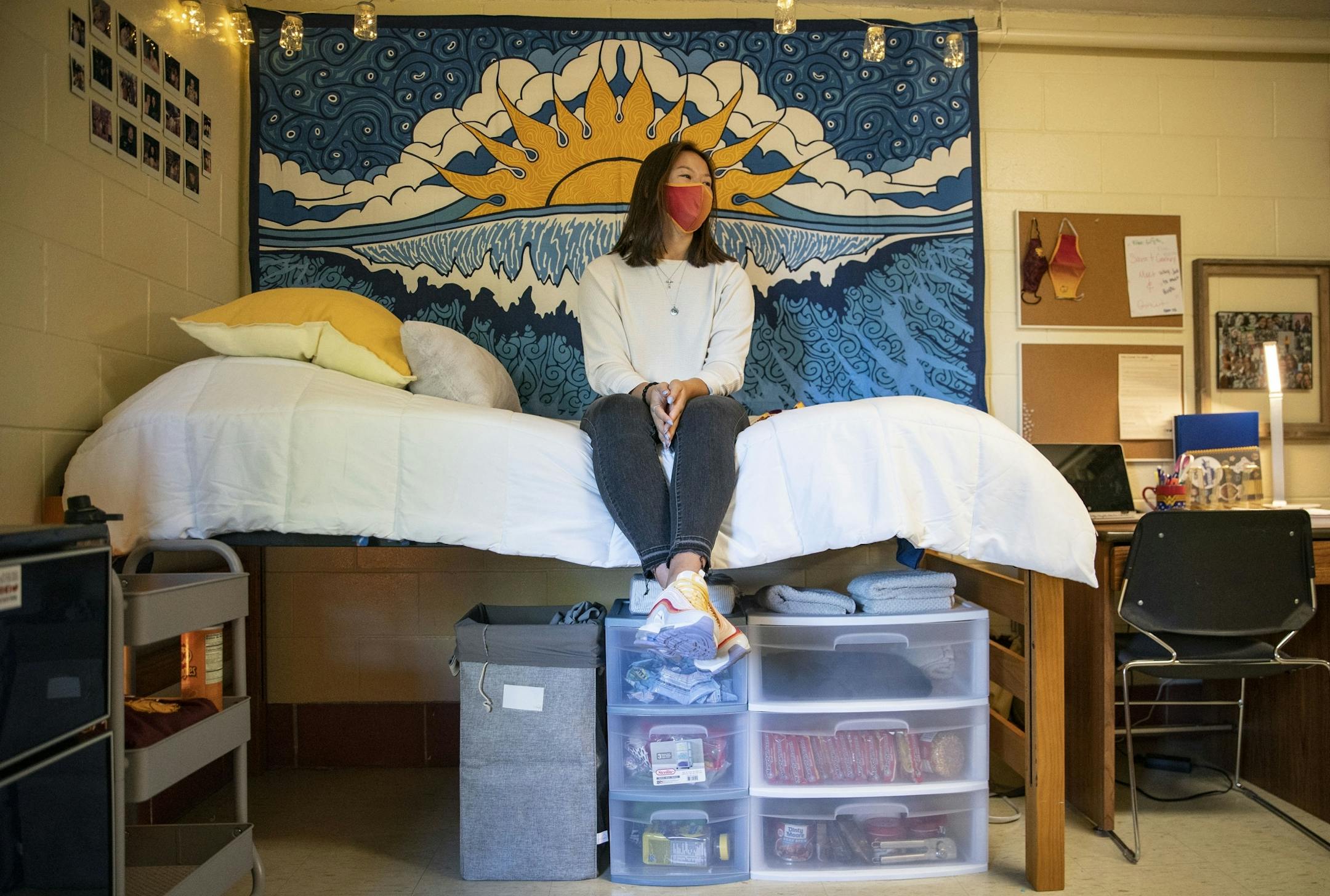 Avery Eckman, a freshman Biology major from Brainerd, Minn. posed for a portrait in her recently decorated room in Griggs Hall at UMD on Thursday.