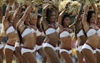 The Washington Redskins cheerleaders perform during fan appreciation day at NFL football training camp at Redskins Park, Saturday, Aug. 4, 2012, in As