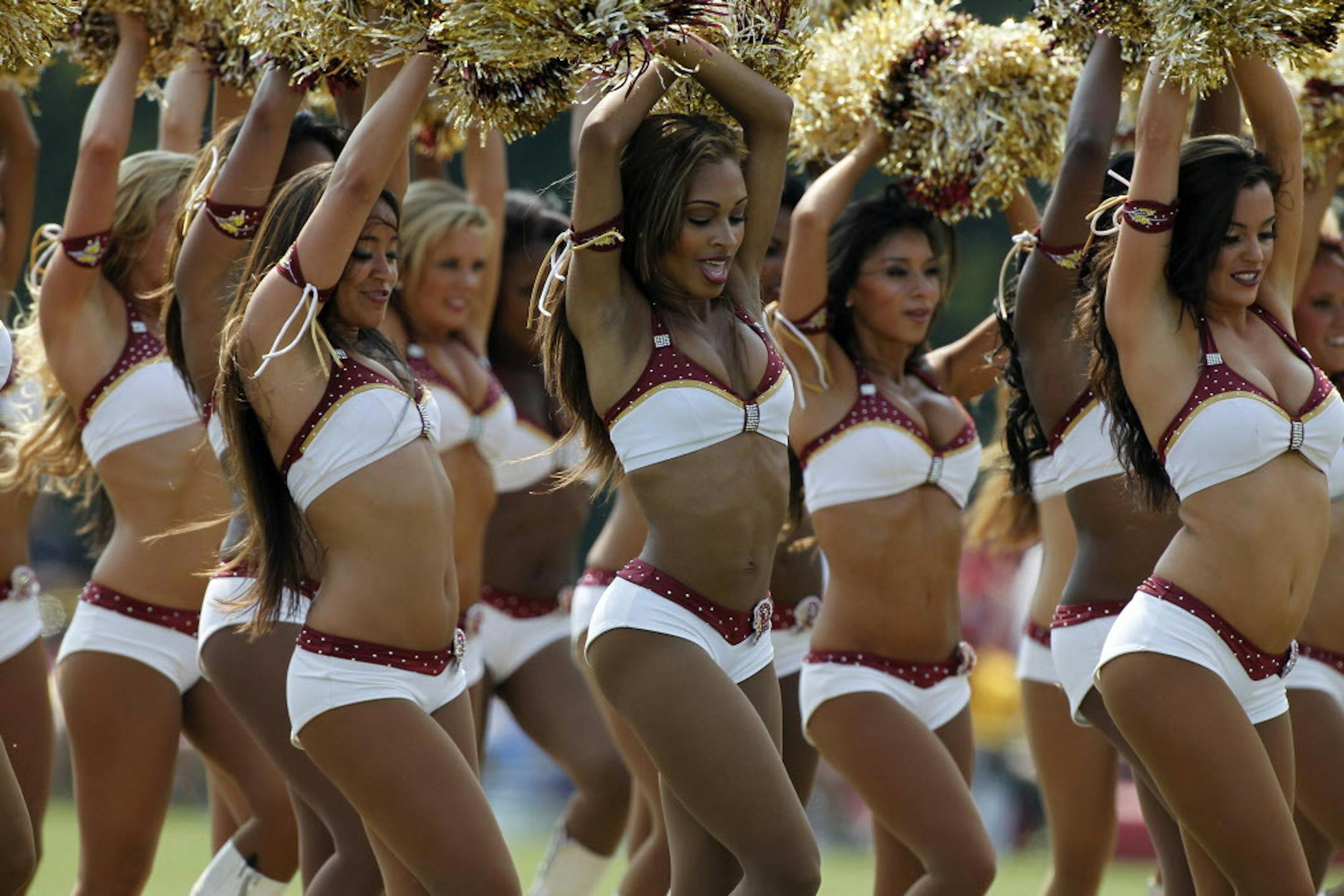 The Washington Redskins cheerleaders perform during fan appreciation day at NFL football training camp at Redskins Park, Saturday, Aug. 4, 2012, in Ashburn, Va. (AP Photo/Alex Brandon)