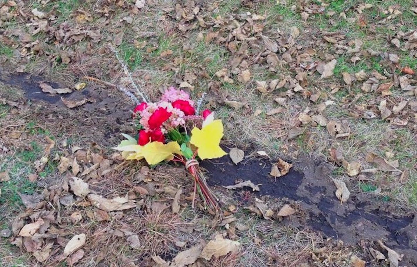 A small bouquet was left in a skid mark left by the car that fatally struck a trick-or-treater along Victory Memorial Parkway.