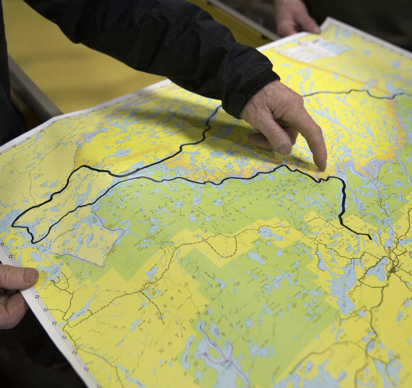 Will Steger, who will leave in coming weeks to canoe the boundary waters, east to west, as they break up with ice, points out the route he will be taking on his 4 week adventure.