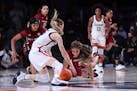 South Carolina and UConn players fought for the ball when the two teams met Dec. 22 in the Bahamas.