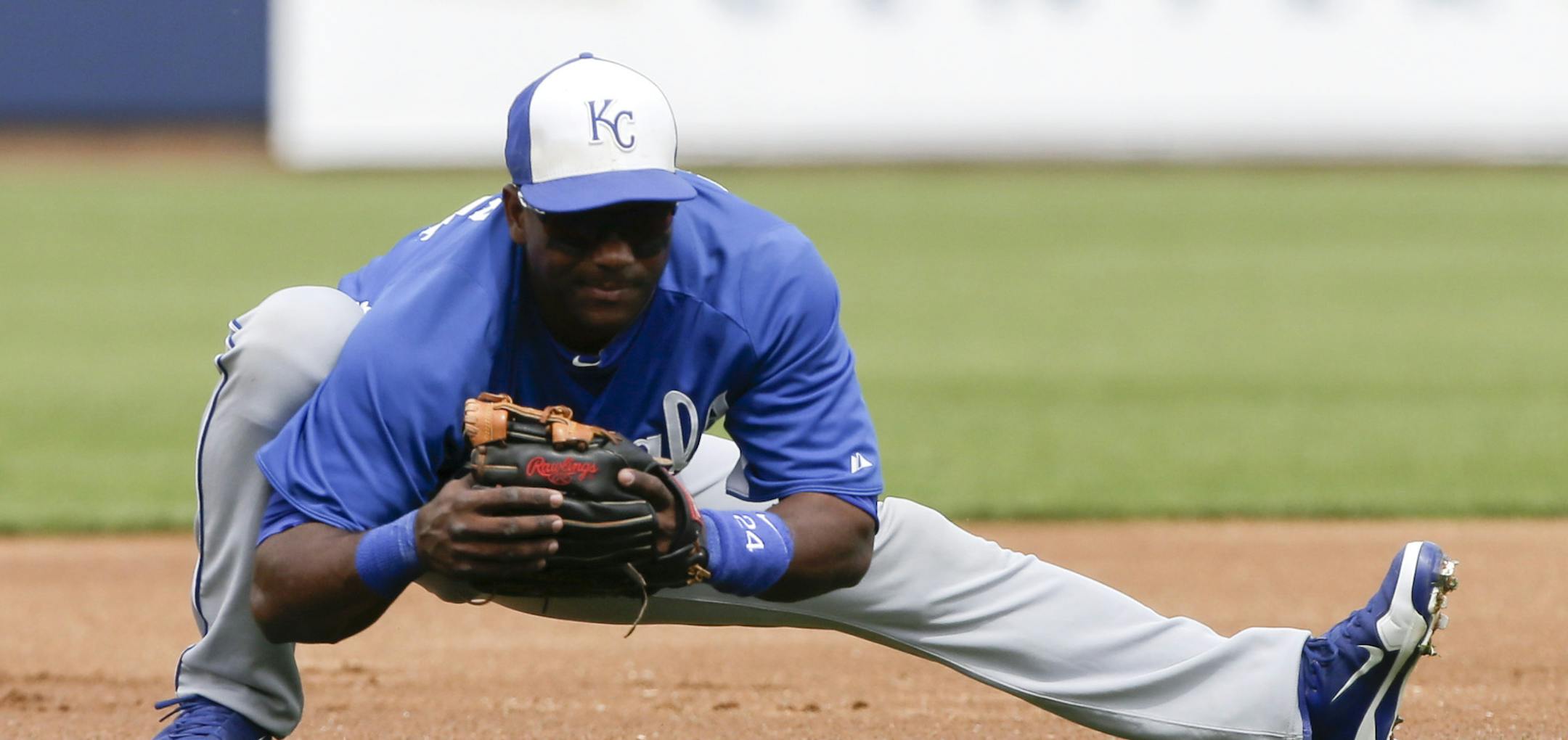 Kansas City Royals third baseman Miguel Tejada warms up during the first inning of a spring training baseball game against the Milwaukee Brewers in Phoenix, Wednesday, March 27, 2013. (AP Photo/Chris Carlson)