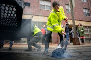 Mayor of Minneapolis Jacob Frey filled a pothole with the city’s asphalt pothole patcher in downtown Minneapolis on Thursday.