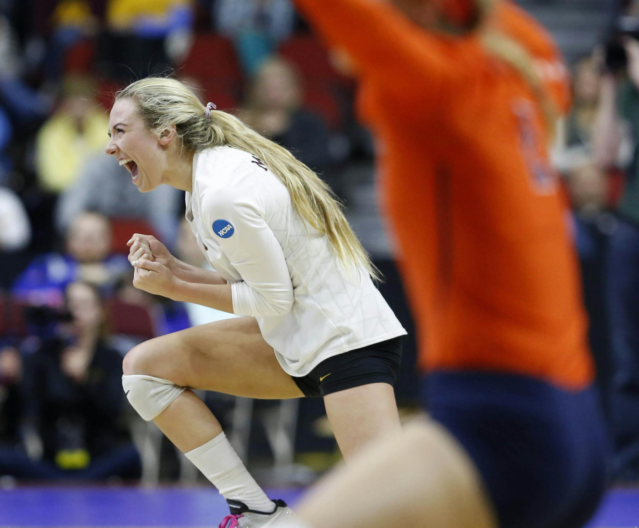 Minnesota's Samantha Seliger-Swenson (11) celebrates a point against Illinois during an NCAA college volleyball game, Friday, Dec. 11, 2015 in Des Moines, Iowa. (Michael Zamora/The Des Moines Register via AP) MAGS OUT, TV OUT, NO SALES, MANDATORY CREDIT