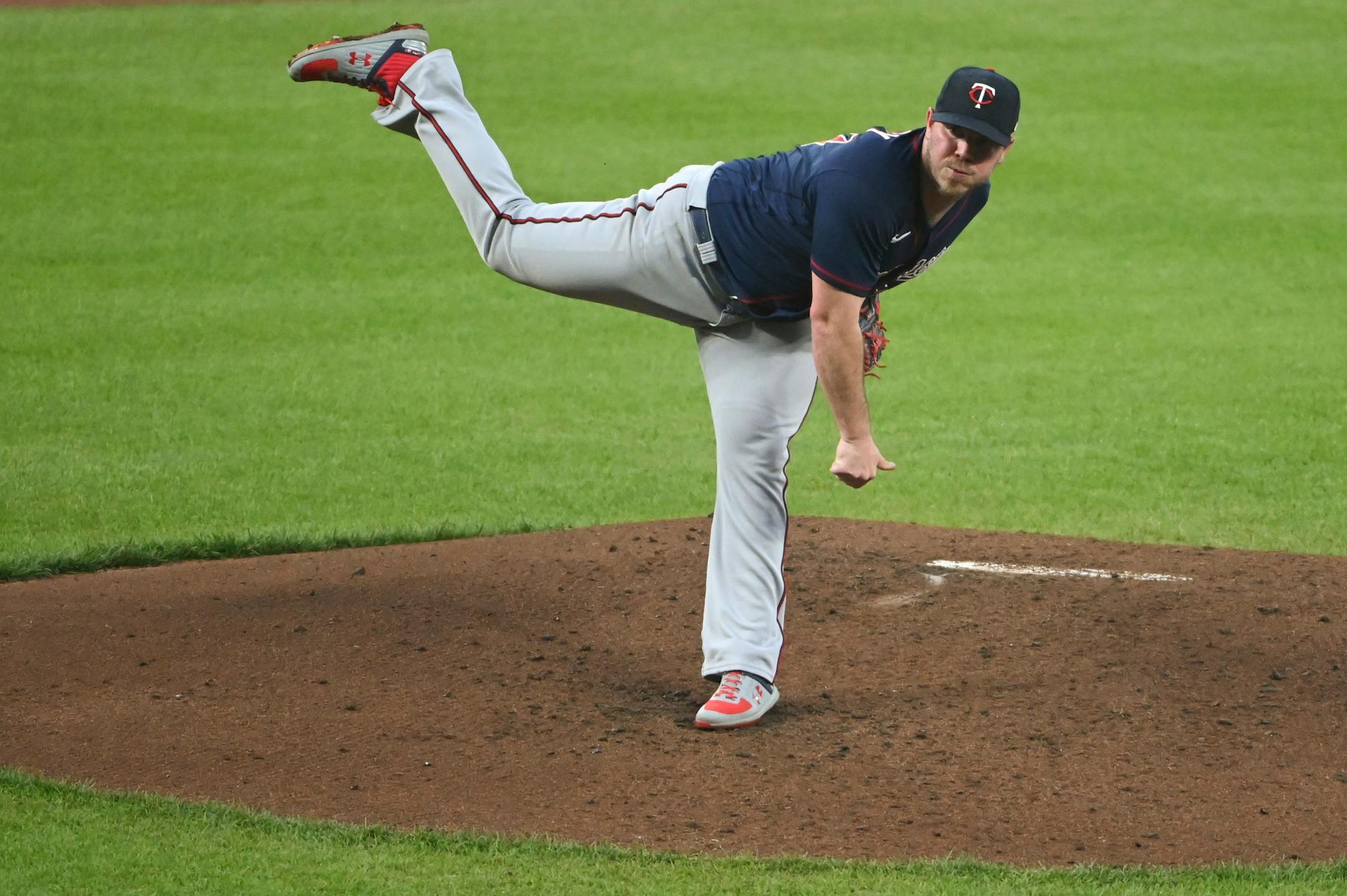 Minnesota Twins starting pitcher Dylan Bundy looks towards home plate after delivering a pitch during the third inning of the team's baseball game against the Baltimore Orioles, Wednesday, May 4, 2022, in Baltimore. (AP Photo/Tommy Gilligan)