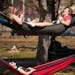 Freshmen Ellie Kohlbeck, top left, Emma Chandler, top right, and Paige Borgmeyer lounged in hammocks after class as temperatures climbed into the mid-