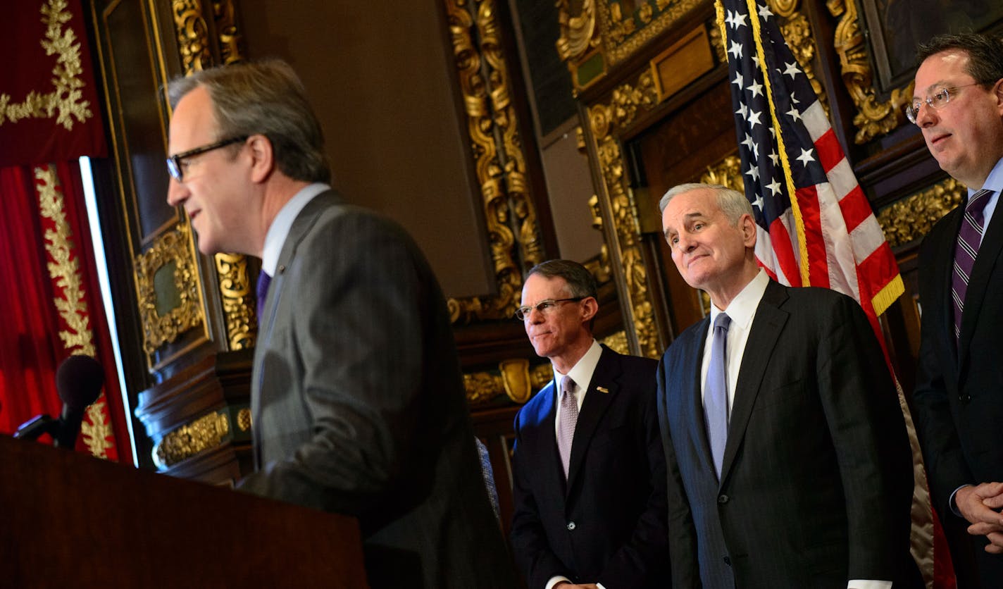 Governor Mark Dayton announced three co-chairs to help organize the campaign to convince the NFL to bring Super Bowl LII to Minnesota in 2018, including Ecolab CEO Doug Baker, left, and U.S. Bancorp CEO Richard Davis, center. On the right is steering committee member Lester Bagly, Vikings V.P.