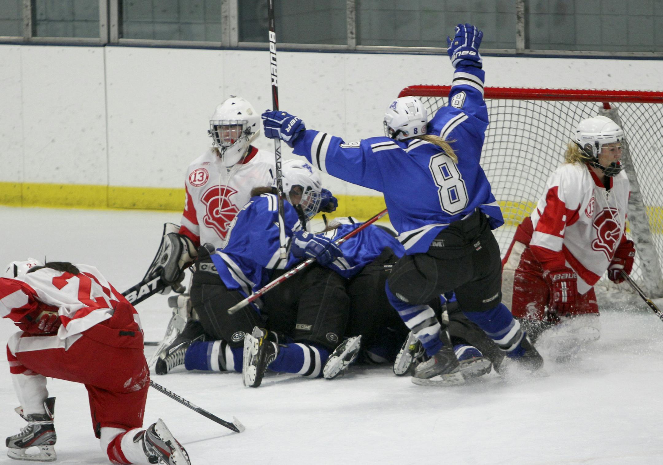 Minnetonka's Sydney Baldwin celebrated with her teammates after Diana Draayer shot the winning goal into the during overtime period action of the Class 2A Section 6 finals in Minneapolis Min., Friday, February 17, 2012. Minnetonka won 2-1. ] (KYNDELL HARKNESS/STAR TRIBUNE) kyndell.harkness@startribune.com