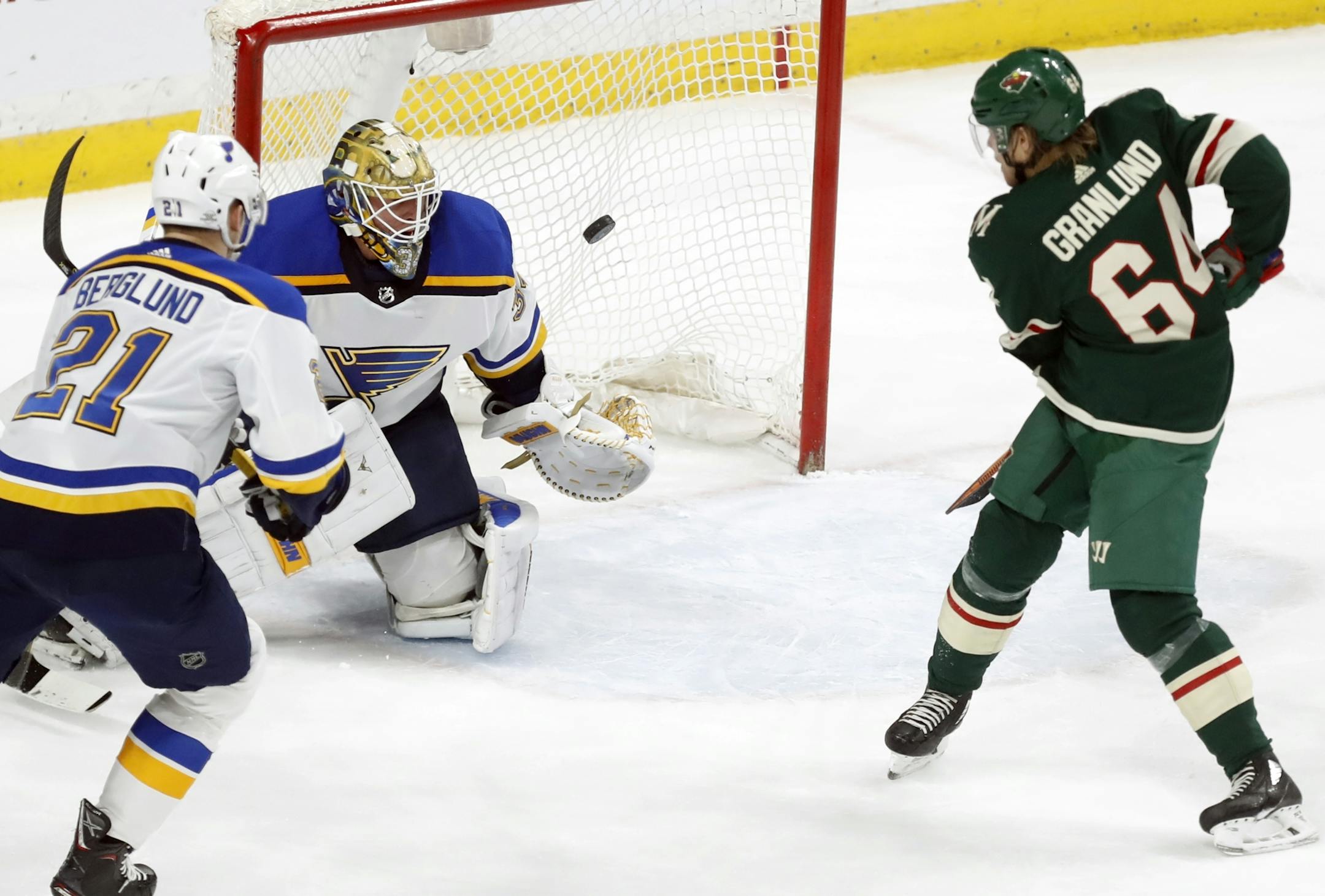 Michael Granlund(64) scores on Jake Allen(34) of the Blues for the third goal of the game.