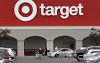 Target is extending a $2-an-hour pay bump and other benefits for store and distribution center workers. Shown is a store in Danvers, Mass. (AP Photo/C