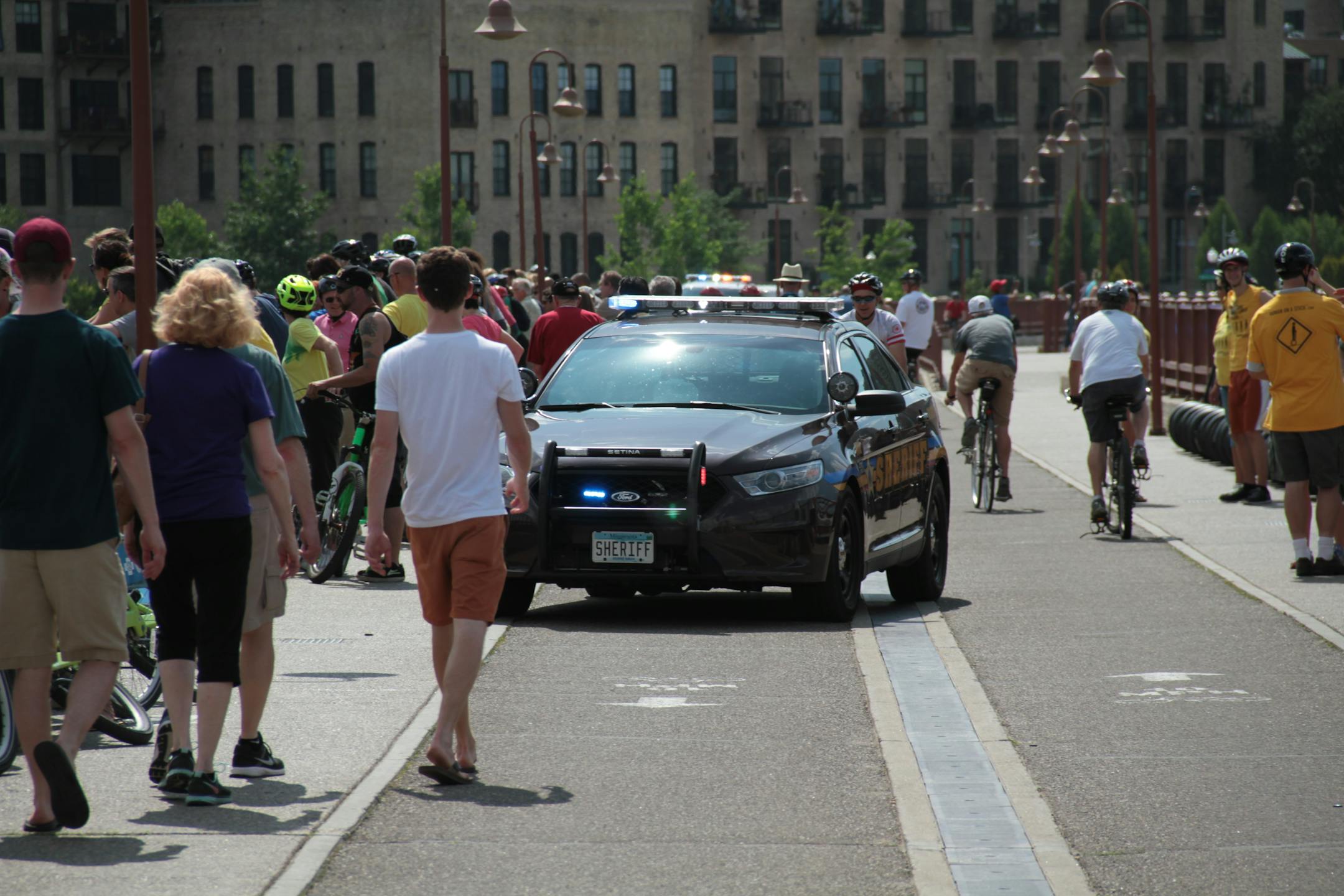 Crowds of people saw the man go off the Stone Arch Bridge in Minneapolis Saturday afternoon.