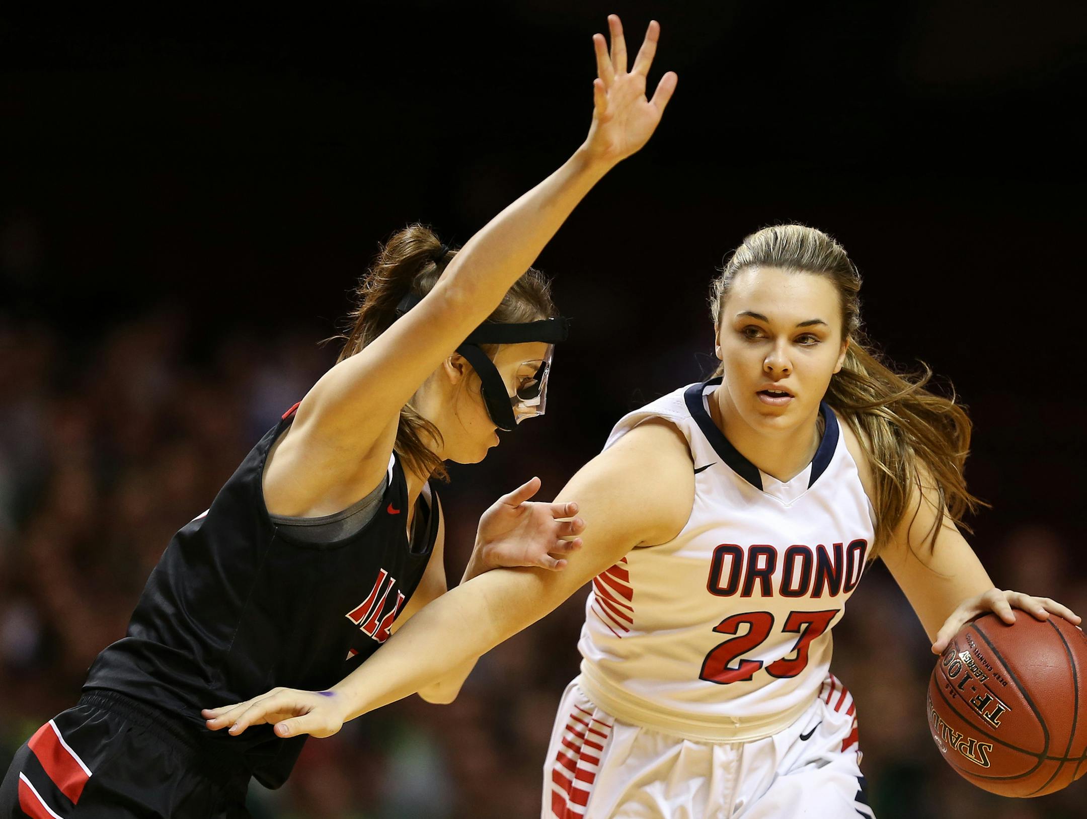 Orono's Tori Andrew (23) dribbled the ball around Alexandria's Emma Ziegler (1) in the first half. ] ANTHONY SOUFFLE ï anthony.souffle@startribune.com Players competed during the girls' basketball state tournament Class 3A semifinal games Thursday, March 16, 2017 at Williams Arena on the grounds of the University of Minnesota in Minneapolis.