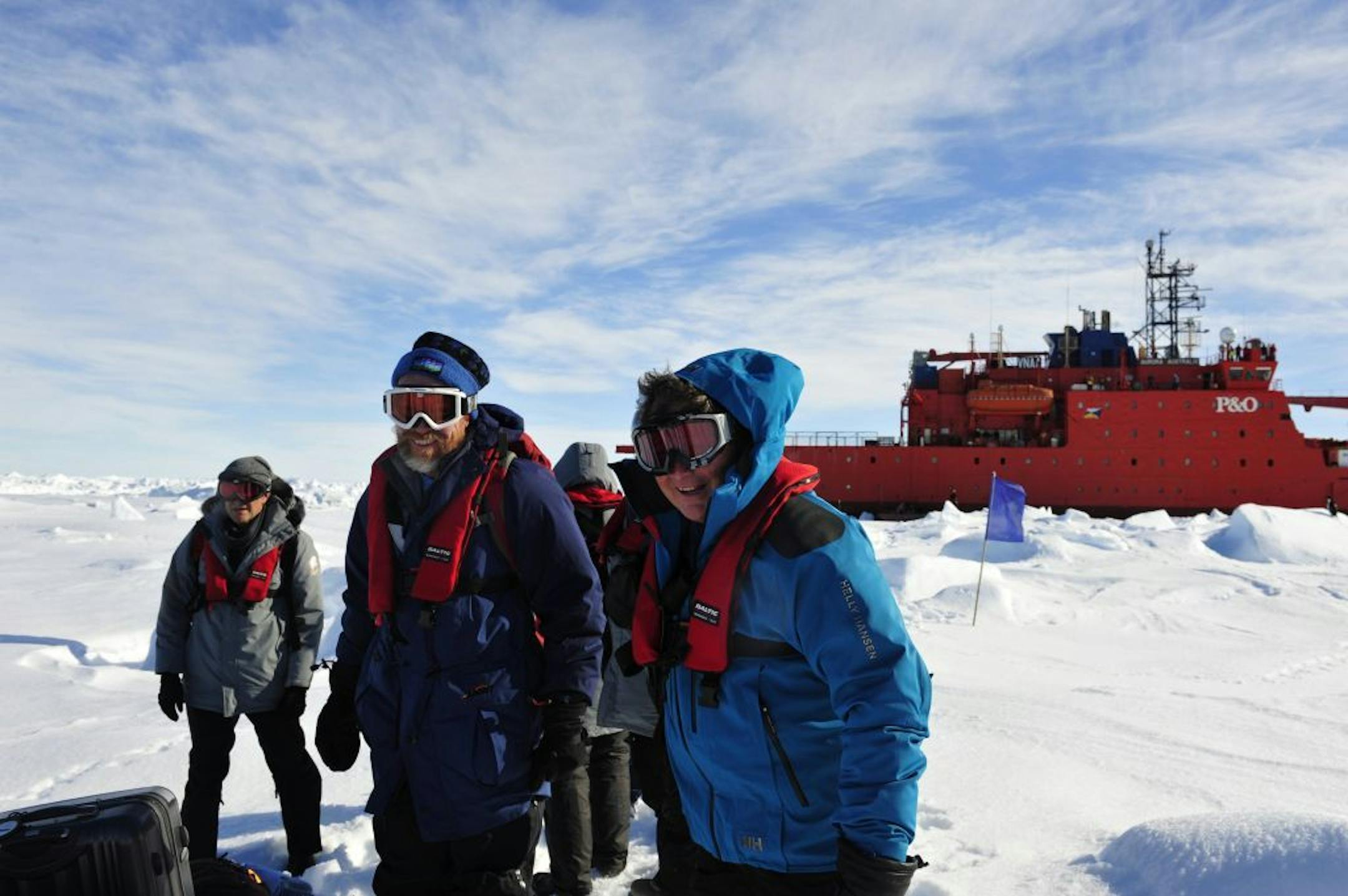 In this photo provided China's official Xinhnua News Agency, the first group of passengers aboard the trapped Russian ship MV Akademik Shokalski arrive at a safe surface off the Antarctic Thursday, Jan. 2, 2014.