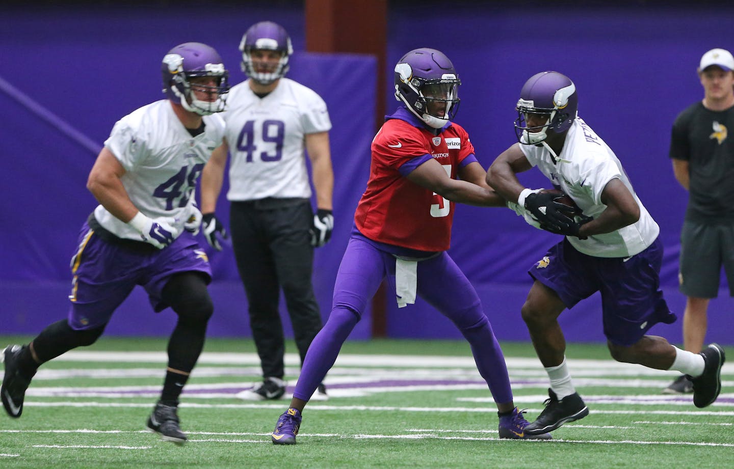 Vikings quarter back Teddy Bridgewater handed the ball off to Adrian Peterson during OTA training at Winter Park Wednesday May 25, 2016 in Eden Prairie, MN.] The Vikings held OTA at Winter Park. Jerry Holt /Jerry.Holt@Startribune.com