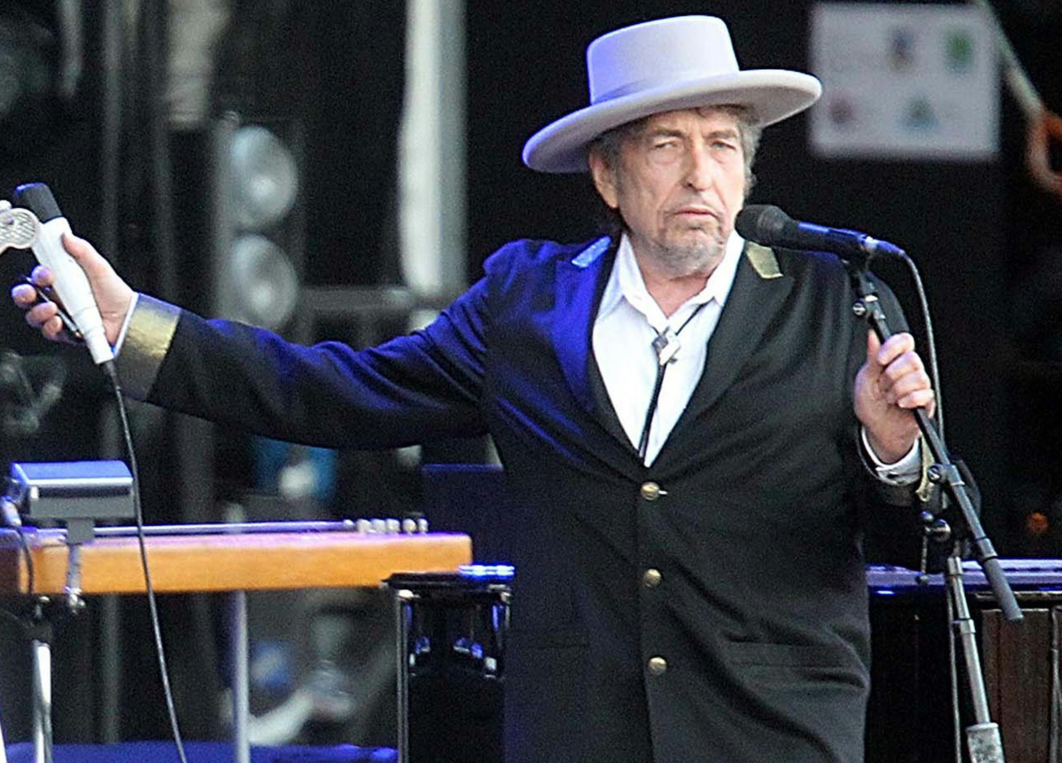 This July 22, 2012 file photo shows U.S. singer-songwriter Bob Dylan performing on stage at "Les Vieilles Charrues" Festival in Carhaix, western France.