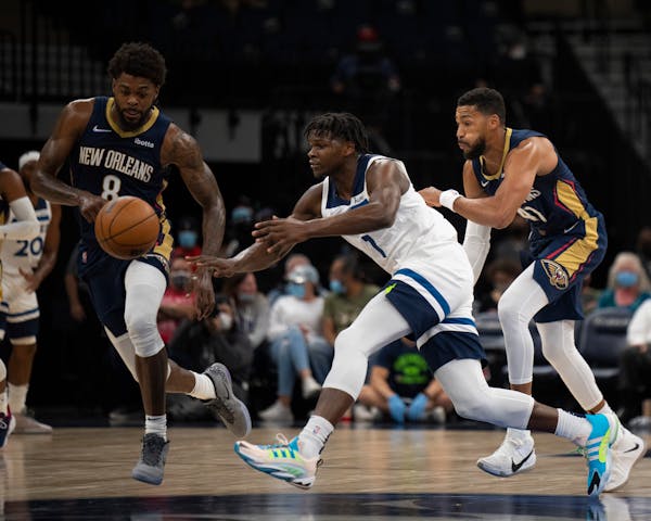 New Orleans Pelicans forward Naji Marshall (8) had a takeaway from Minnesota Timberwolves forward Anthony Edwards (1) in the first quarter. ] JEFF WHE