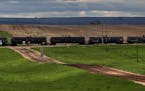 A long train carrying oil tank cars travelled west, near Gladstone ND. Oil production in North Dakota is coming close to 1 million barrels a day, with
