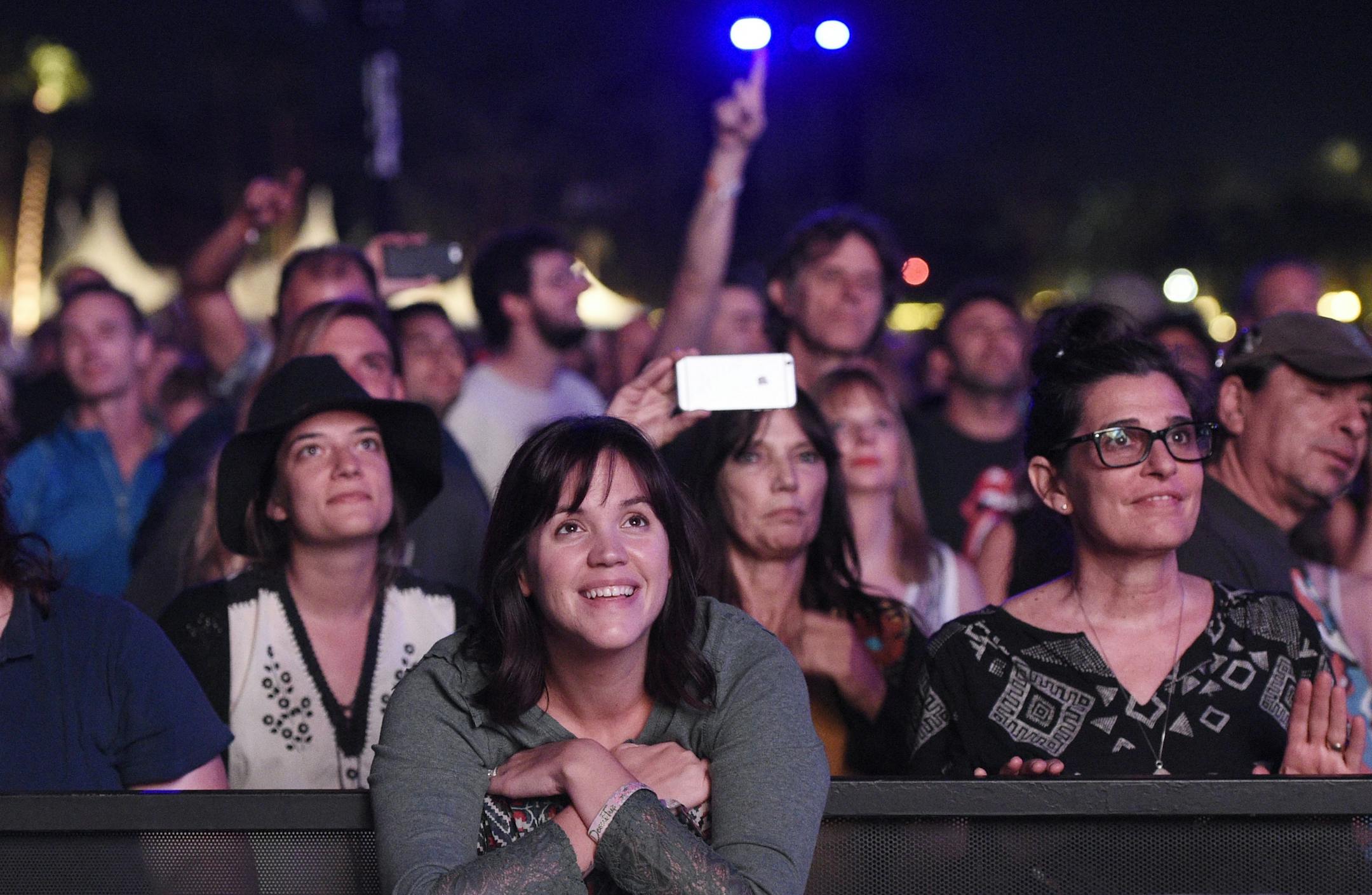Festivalgoers watch The Rolling Stones perform on day 1 of the 2016 Desert Trip music festival at Empire Polo Field on Friday, Oct. 7, 2016, in Indio, Calif.