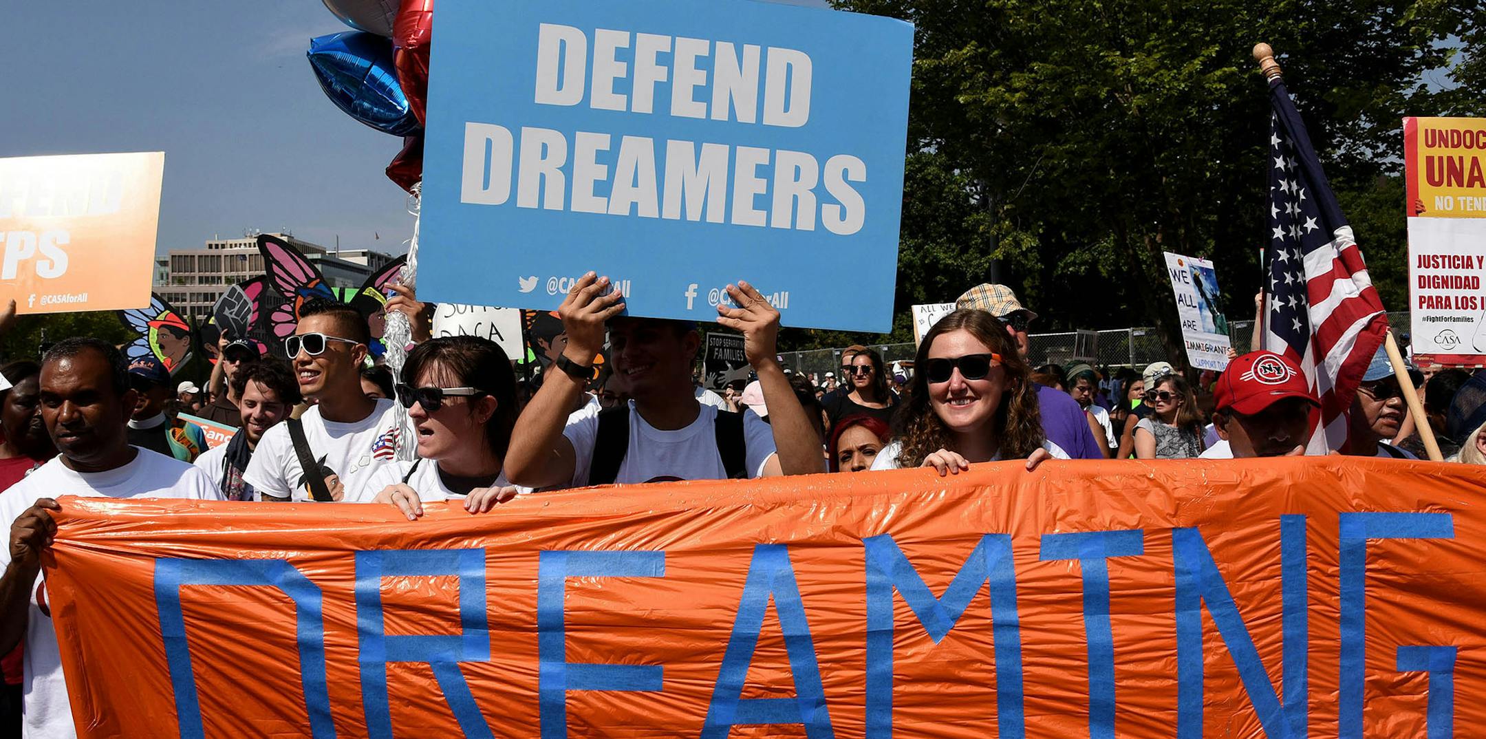 Protesters hold up signs during a rally supporting Deferred Action for Childhood Arrivals, or DACA, outside the White House on September 5, 2017. Thousands are expected to gather for rallies on Tuesday, when President Trump is slated to announce the future of the program. (Olivier Douliery/Abaca Press/TNS) ORG XMIT: 1210309 ORG XMIT: MIN1709051210211174