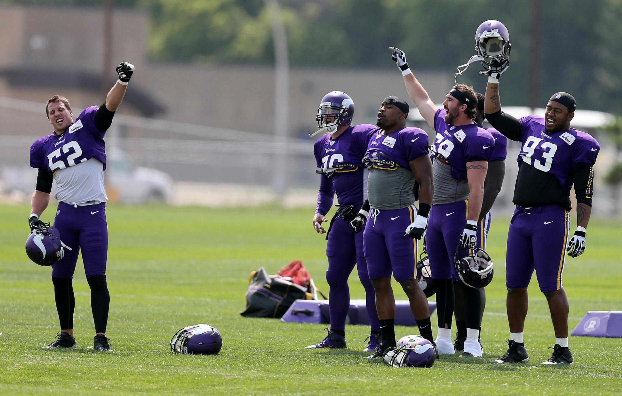 Vikings defensive players, led by Chad Greenway, cheered their teammates during Monday afternoon's practice in Mankato.
