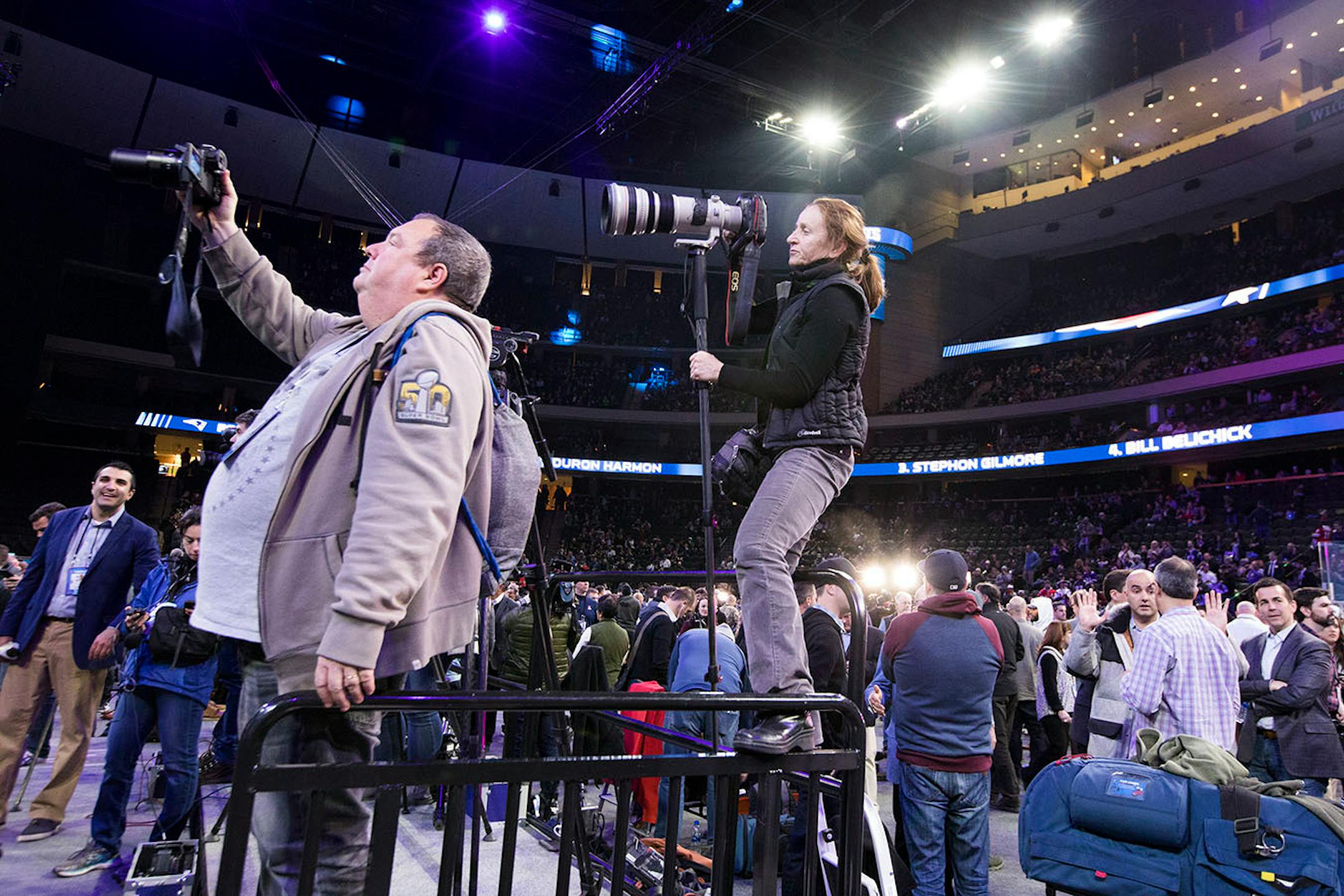 Media vies for a photo of Tom Brady.