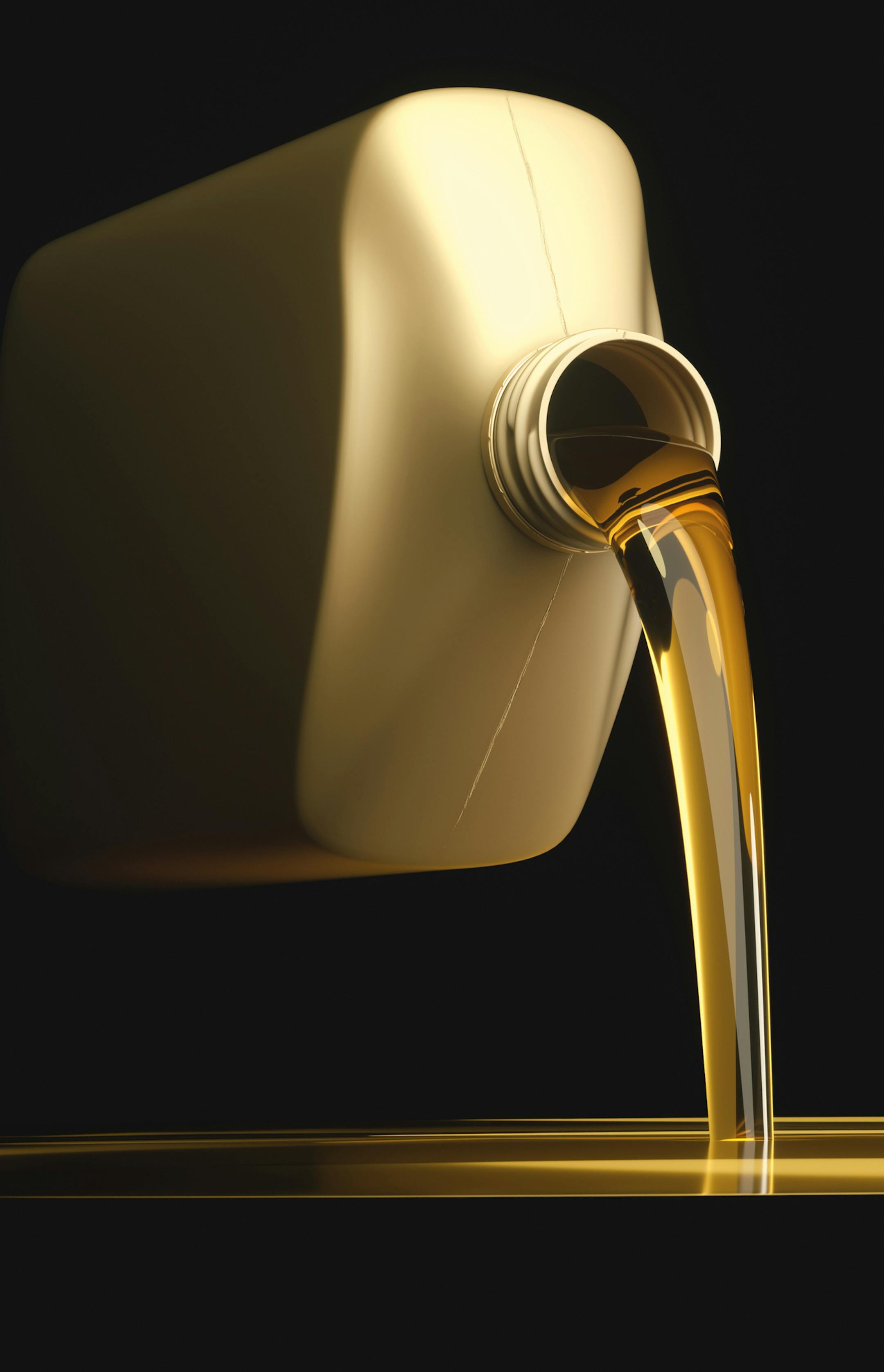 3D illustration. Pouring engine oil on flat surface with black background. Your text on the black background.
