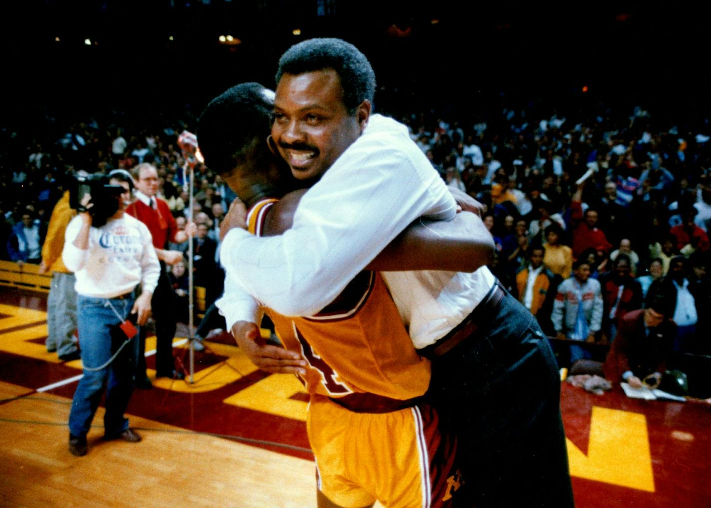 January 27, 1989 Gophers coach Clem Haskins gleefully embraced Willie Burton, who paced the upset with 20 points and 13 rebounds. Brian Peterson, Minneapolis Star Tribune