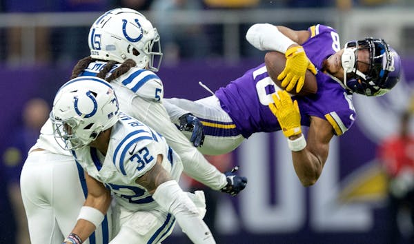 Stephon Gilmore (5) of the Indianapolis Colts is called for a penalty after a hit on Justin Jefferson (18) of the Minnesota Vikings in the fourth quar