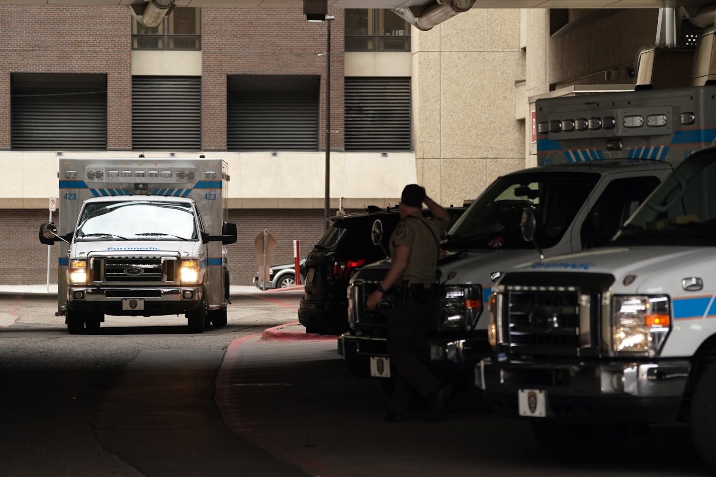 Ambulances came and went at Hennepin County Medical Center Thursday. ] ANTHONY SOUFFLE &#x2022; anthony.souffle@startribune.com Ambulances came and went at Hennepin County Medical Center Thursday, April 2, 2020 in Minneapolis.