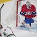 Montreal Canadiens goaltender Carey Price is scored against by Minnesota Wild's Jordan Schroeder during second-period NHL hockey game action in Montre