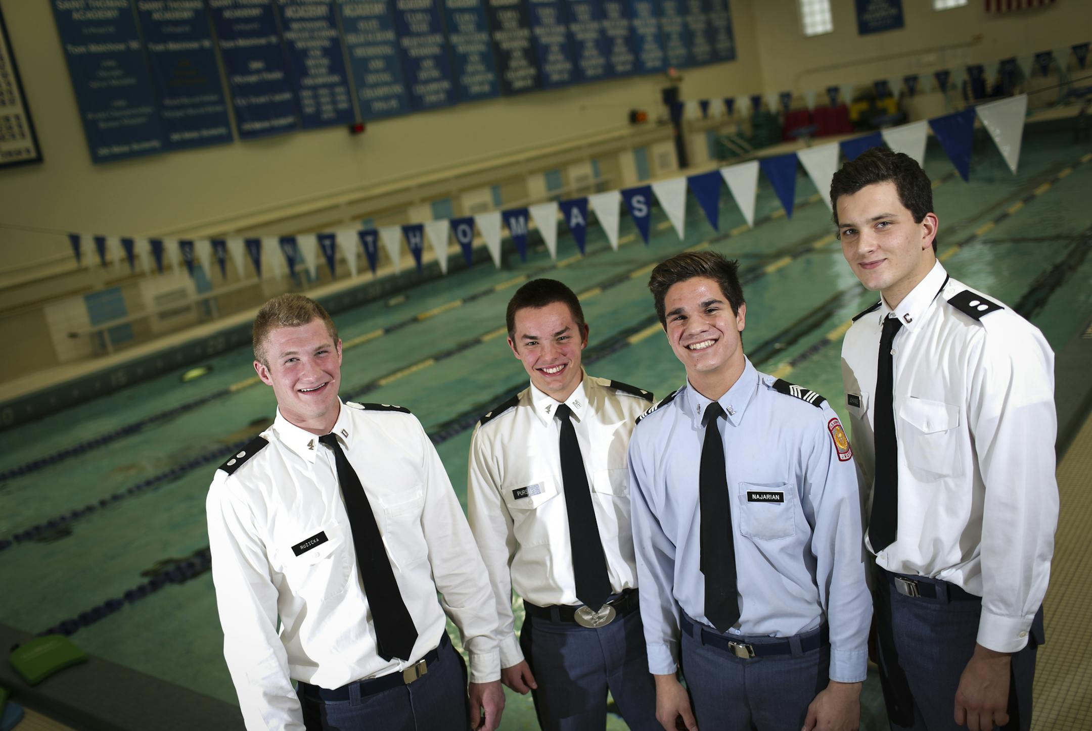 Senior swimming captains from the left; Matt Ruzicka, Jake Pursley, Jon Najarian, and Sam Johanns at St. Thomas Academy in Mendota Heights, Minn., on Tuesday, December 2, 2014. ] REN√âE JONES SCHNEIDER reneejones@startribune.com