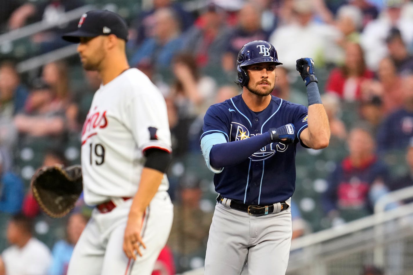 Tampa Bay Rays' Josh Lowe, right, celebrates after hitting an RBI single during the first inning of a baseball game against the Minnesota Twins, Monday, Sept. 11, 2023, in Minneapolis. (AP Photo/Abbie Parr)