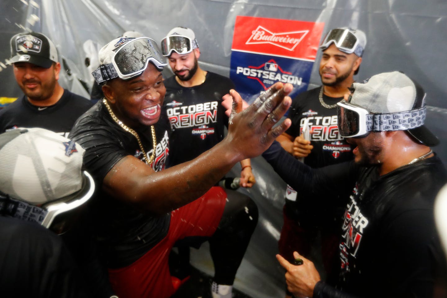 Miguel Sano celebrates with teammates after the Twins clinched the AL Central Division championship on Wednesday night.