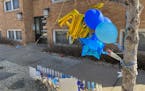 A memorial for Tanasha Austin was created at the scene of the shooting in the Lowry Hill neighborhood of Minneapolis. Family and friends gathered Satu