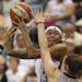 The Lynx' Seimone Augustus looked for a shot over the defense of the Stars' Samantha Logic in the third quarter Sunday night at Target Center.