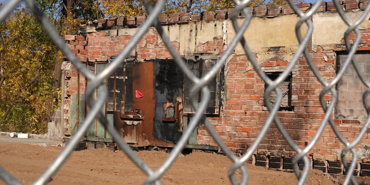 A pile of cinder blocks and part of one exterior wall is all that remains of Uncle Hugo's science fiction book store on Chicago avenue that was burned in the riots following the death of George Floyd. ] ANTHONY SOUFFLE • anthony.souffle@startribune.com Uncle Hugo's owner Don Blyly can't afford to rebuild at his current location, so he is planning to sell his riot-damaged site on Chicago avenue to his next door neighbor, dentist Dr. Ali Barbarawi, who both visited the property Thursday, Oct. 8, 2