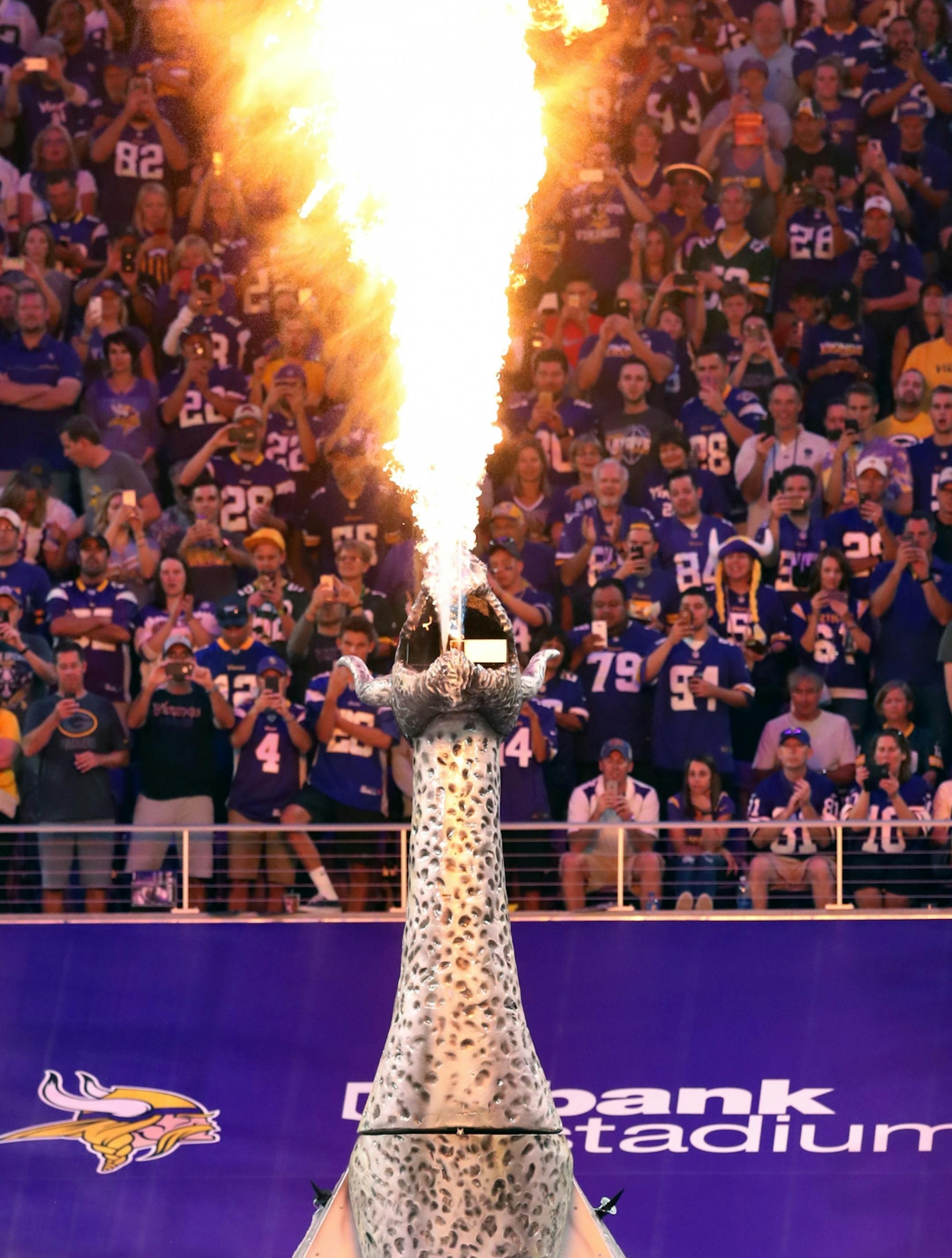 A fire breathing dragon greeted the Vikings as they took to the field. The Minnesota Vikings open the new US Bank Stadium for their first home regular season game against the Green Bay Packers. Here,