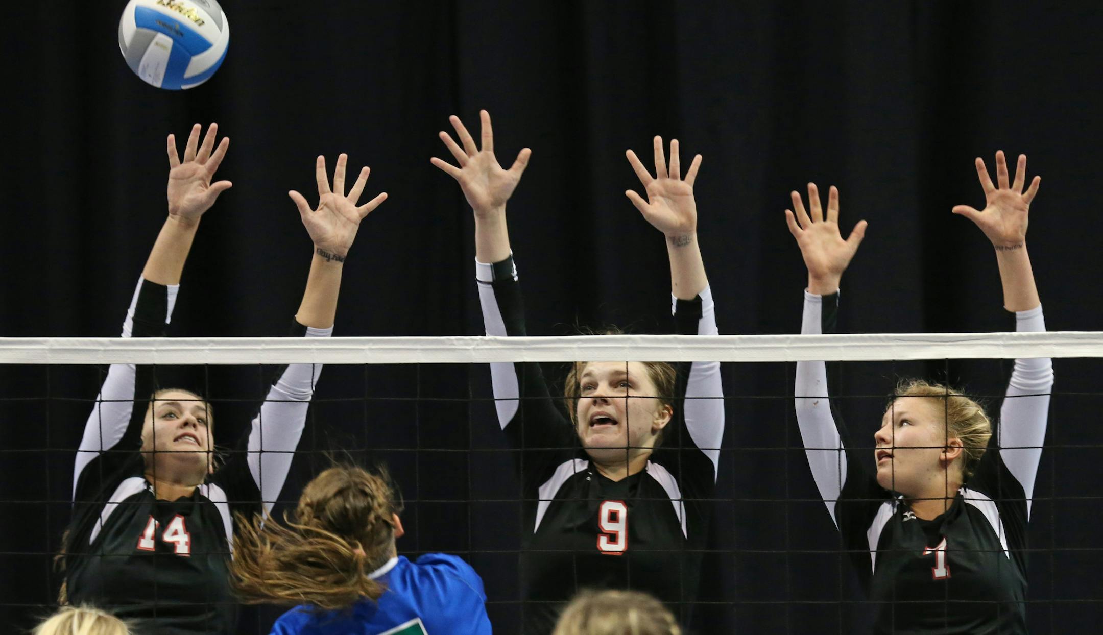 Minnesota State High School League Girls Volleyball State Tournament, 11/8/13, Xcel Energy Center. Class 3A state volleyball semifinals, Eagan vs Eden Prairie. (left to right-top row) Eden Prairie's Ashley Brueggeman, Emma Teal and Abby Ihrke went high to try and block Eagan's Taylr McNeil's shot.] Bruce Bisping/Star Tribune bbisping@startribune.com Ashley Brueggeman, Emma Teal, Abby Ihrke, Taylr McNeil's/roster.