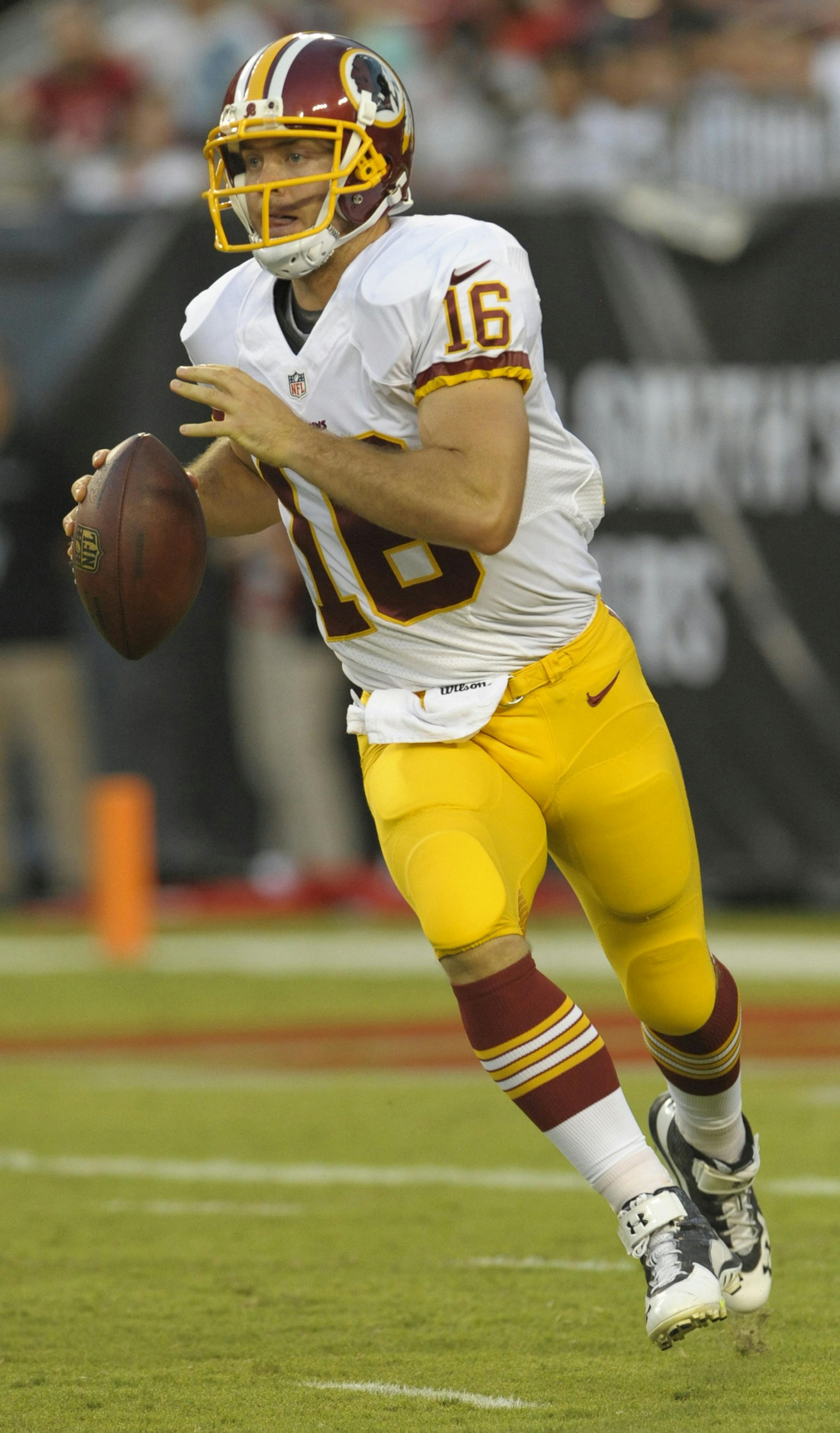 Washington Redskins quarterback Colt McCoy scrambles against the Tampa Bay Buccaneers during during a NFL preseason football game Thursday, Aug. 28, 2014 in Tampa, Fla. (AP Photo/Steve Nesius) ORG XMIT: FLSN205
