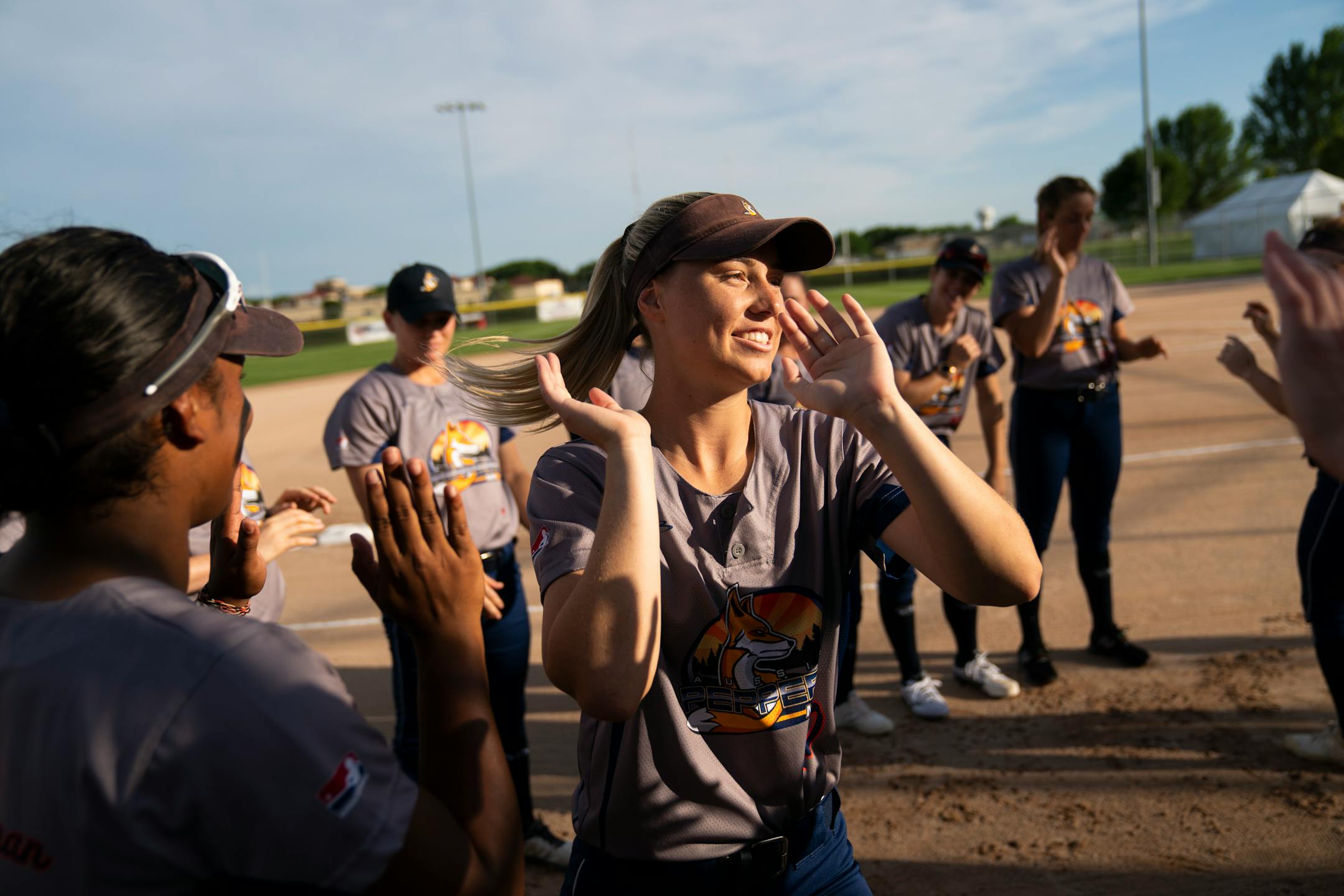 Aussie Peppers' Shannon Keevers (10) gave her teammates a high-five as she was announced before a game against the Canadian Wild in North Mankato, Minn. Wednesday, July 3, 2019. ] RENEE JONES SCHNEIDER ¥ renee.jones@startribune.com
