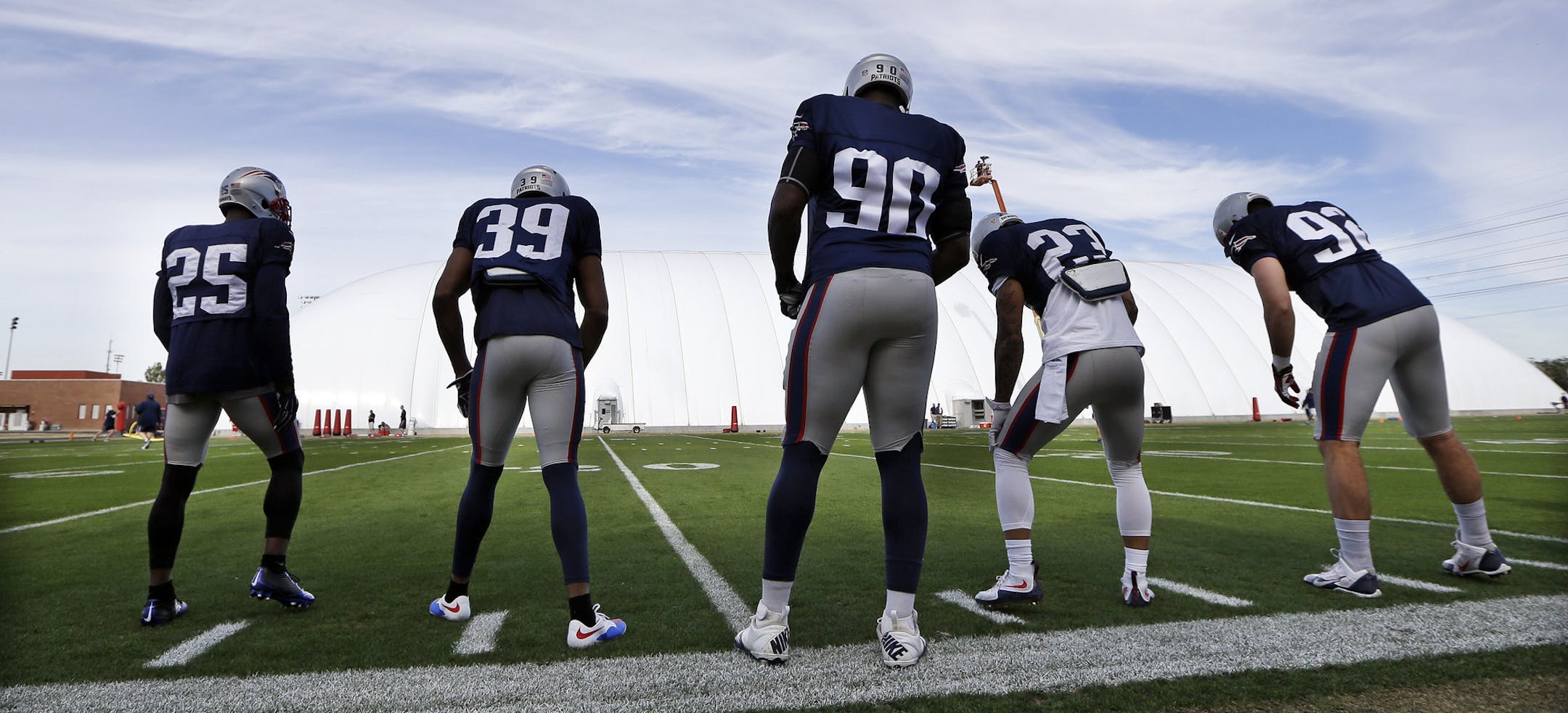 New England Patriots players practice at the Arizona Cardinals' facility Wednesday, Jan. 28, 2015, in Tempe, Ariz. From left are cornerback Kyle Arrington (25), cornerback Brandon Browner (39), defensive end Zach Moore (90), safety Patrick Chung (23), and practice squad defensive end Jake Bequette (92). The Patriots play the Seattle Seahawks in NFL football Super Bowl XLIX Sunday, Feb. 1, in Glendale, Ariz. (AP Photo/Mark Humphrey)