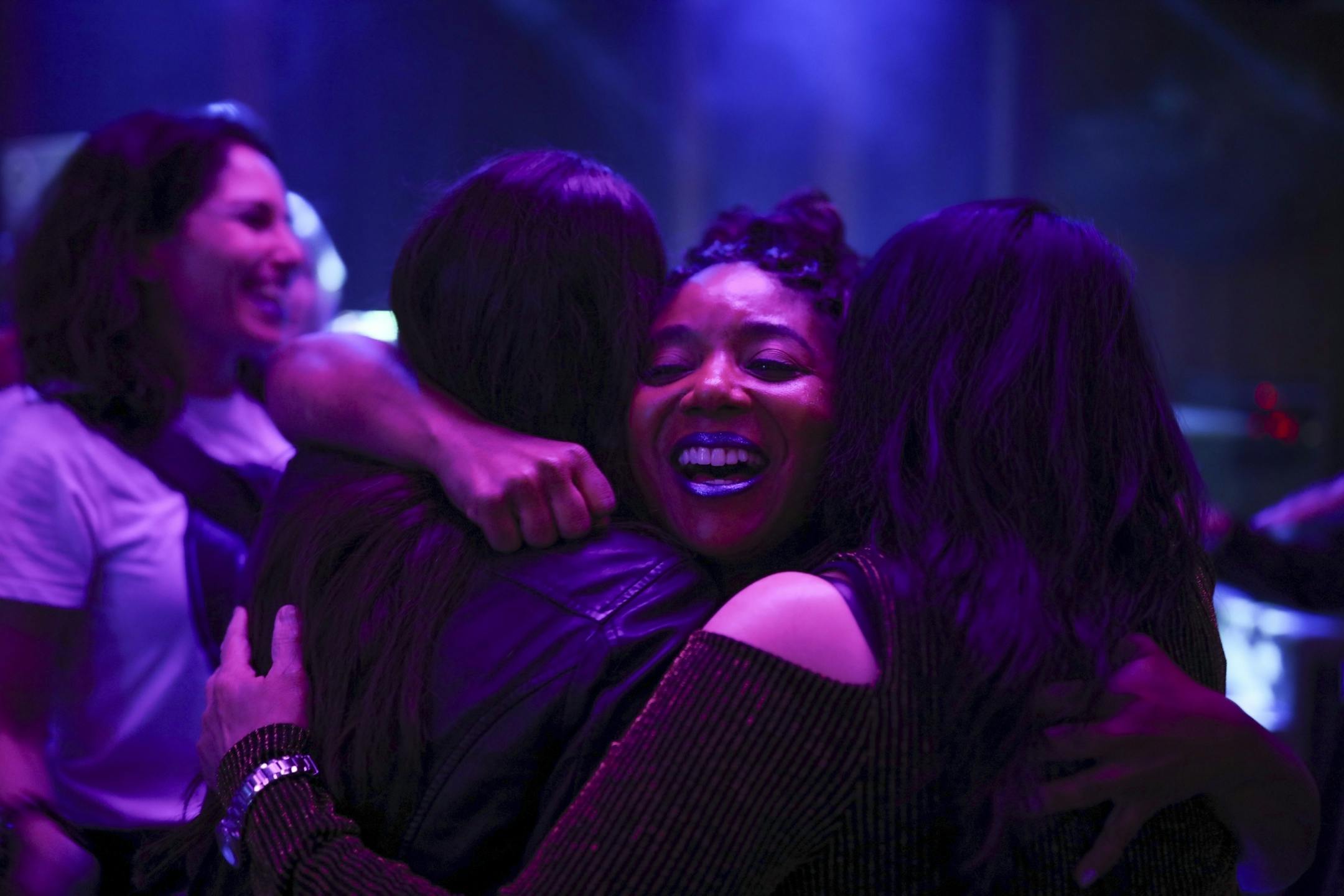 Tameir Powell of Hayward, CA was hugged by friends when she arrived at the "Free Urself Dance Party" at Lee's Liquor Lounge Wednesday night.