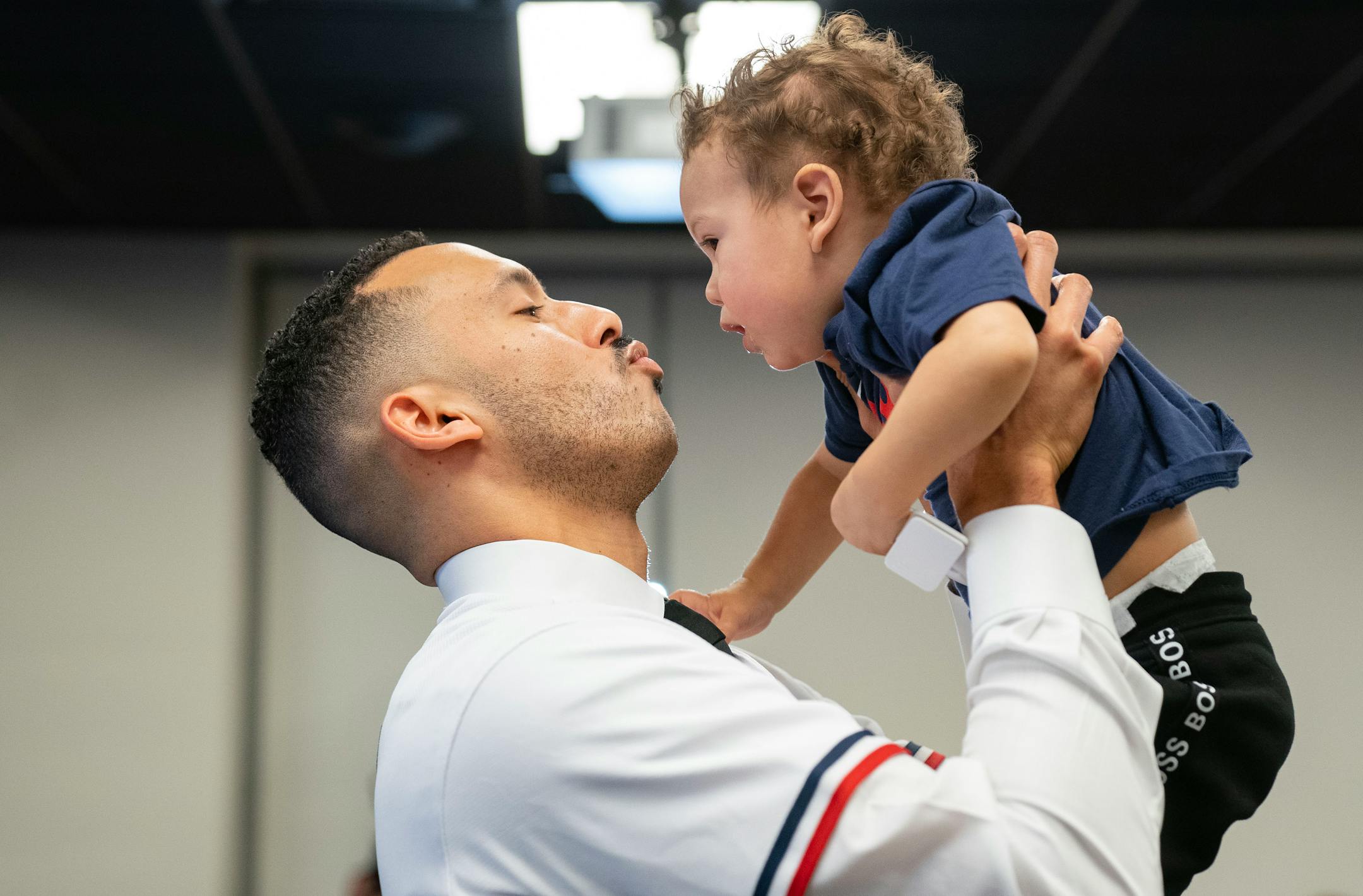 Minnesota Twins shortstop Carlos Correa embraces his son, Kylo, 1, after a press conference to announce Correa's re-signing.