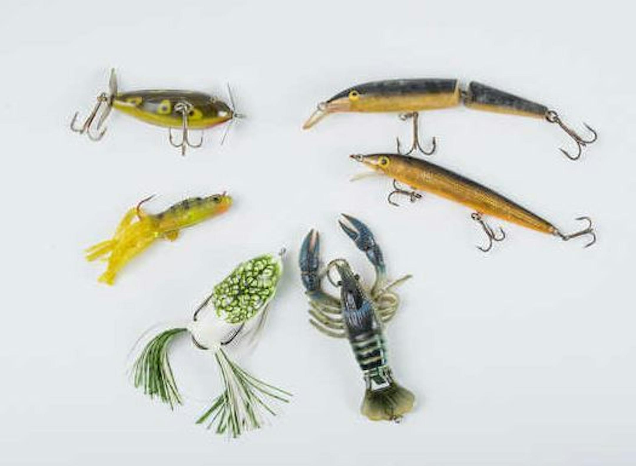 Some of Dennis Anderson's go-to baits include a Creek Chub, upper left, and a jointed floating Rapala.