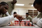 Cook County Jail detainees Jonathan Ivory, left, and Rashad Rowry practice before their next matches in a round-robin chess tournament with prisoners 