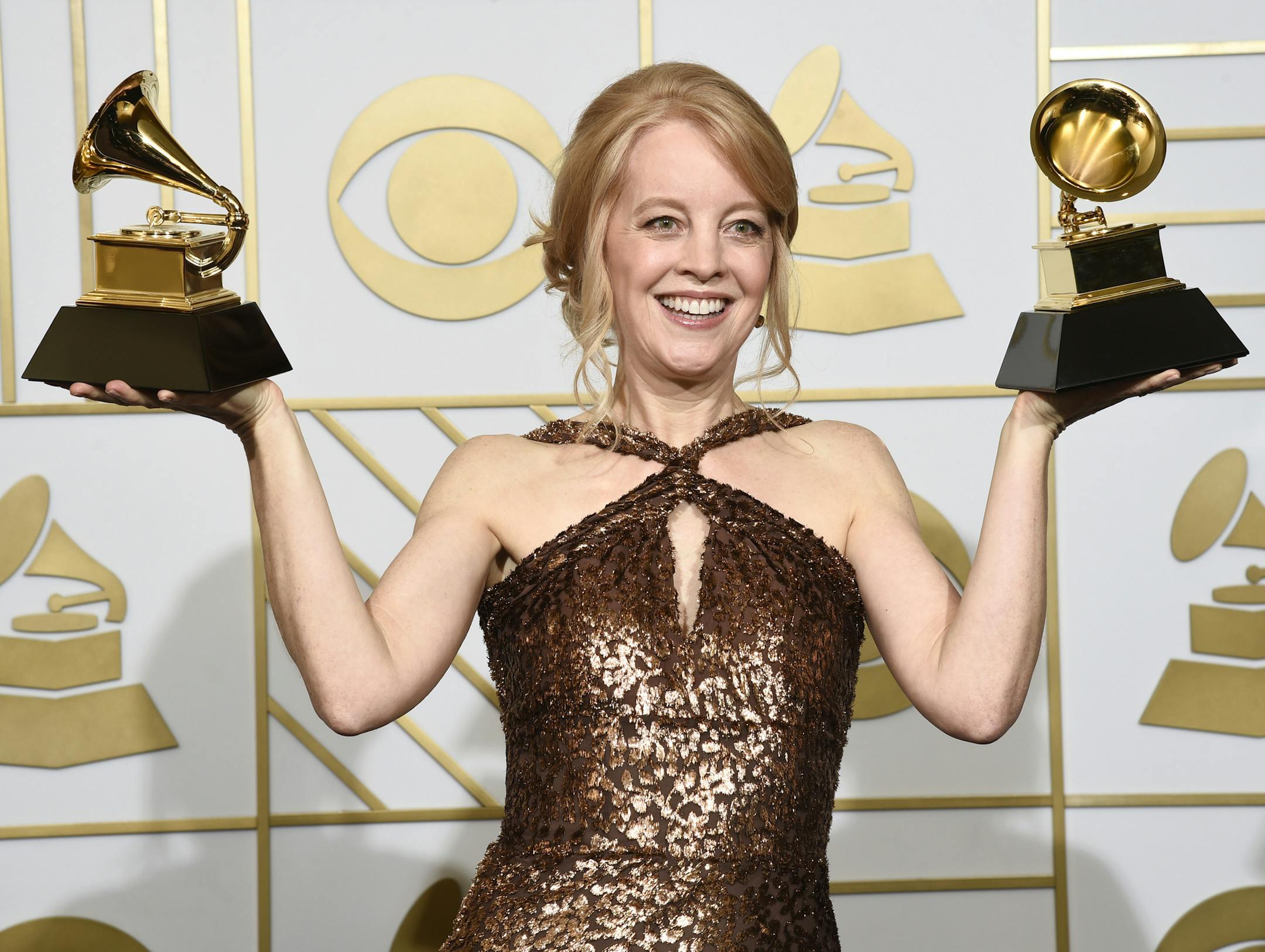 Maria Schneider poses with the award for best arrangement, instruments and vocals for "Sue (Or In A Season Of Crime) " and the award for best large jazz ensemble album for "The Thompson Fields" in the press room at the 58th annual Grammy Awards at the Staples Center on Monday, Feb. 15, 2016, in Los Angeles. (Photo by Chris Pizzello/Invision/AP) ORG XMIT: MIN2016021518411106