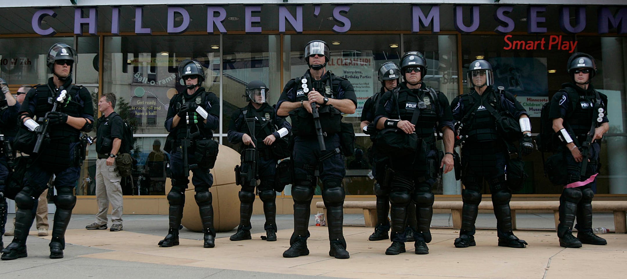 Police officers, dressed in riot gear, gathered outside the Minnesota Children's Museum in downtown St. Paul on Monday. St. Paul Mayor Chris Coleman praised the officers' overall performance.